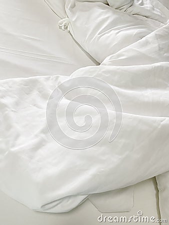 Top view of the crease of an unmade bed sheet in the bedroom after a long night sleep and waking up in the morning Stock Photo