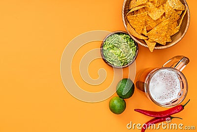 View of crispy nachos, guacamole, beer Stock Photo