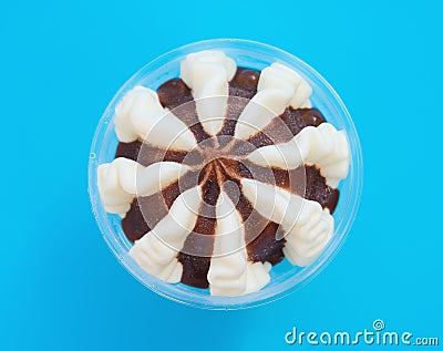 Top view cup of chocolate flavor ice cream on blue background Stock Photo