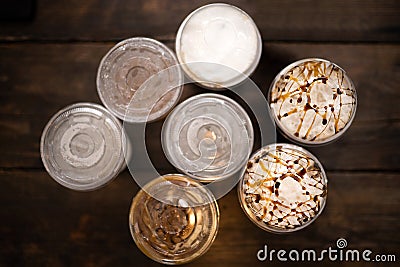 Top view of cups with cold drinks on wood background-concept of sweets Stock Photo