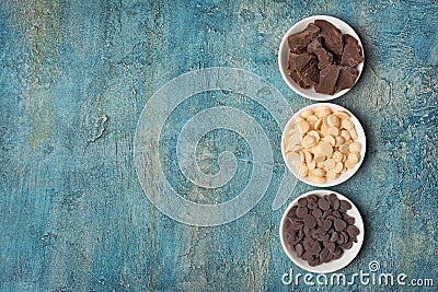 Top view of dark and white chocolate drops or morsels and chunk Stock Photo