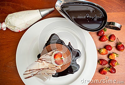 Top view of a decorated tiramisu cake with strawberries. Stock Photo