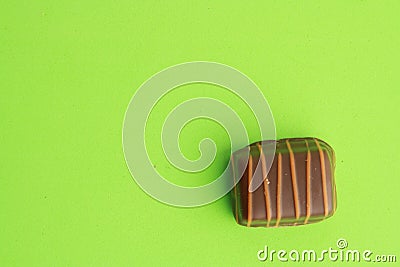 Top view of delicious Belgium chocolate on a green background Stock Photo