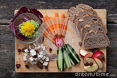 Top view of delicious vegan appetizer served on wooden board Stock Photo