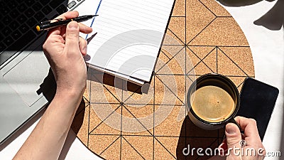 Take a cup of coffee while you are working at home on a sunny day Stock Photo