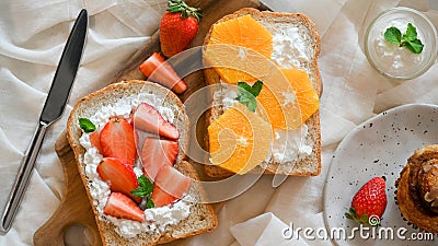 Top view, Diet breakfast, Toast with fresh slide orange and strawberry Stock Photo