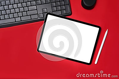 Digital tablet with empt display on red background. Stock Photo