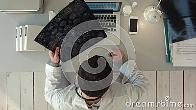 Top view of Doctor interpreting scan of the brain Stock Photo