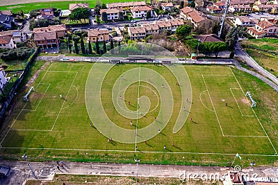 Top view from drone of football soccer field- Two teams playing a match and having a competition Editorial Stock Photo