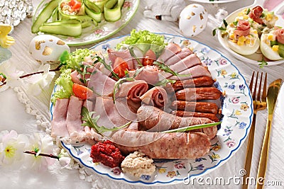 Top view of Easter breakfast with a plate of cold cuts and white sausage Stock Photo