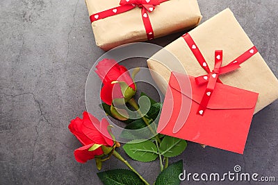 Top view envelope and rose flower on black background Stock Photo