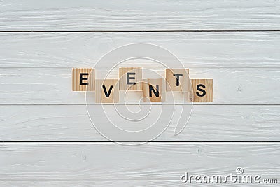 top view of events word made of wooden blocks on white wooden surface Stock Photo