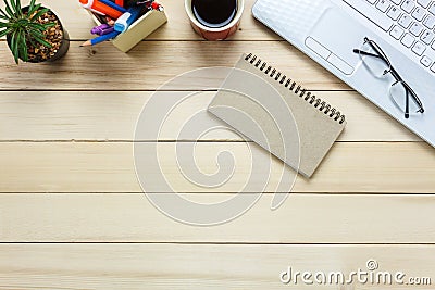 Top view eyeglasses,pen,black coffee,cactus, ,Laptop,stationary,notebook on office desk background. Stock Photo