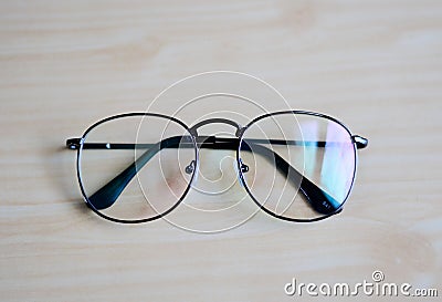 Top view Eyeglasses on wood table. Stock Photo