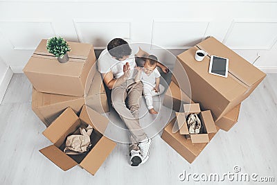Top view. Father and son moving into a new home Stock Photo