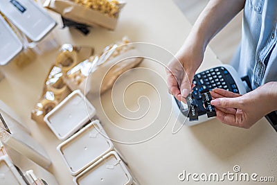 Top view female hands creating names title stickers for food comfortable storage use labeler machine Stock Photo