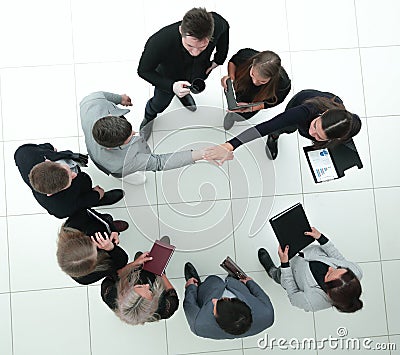 Top view. financial partners confirming the transaction with a handshake. Stock Photo