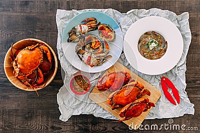 Top view of Fish Sauce-Fermented raw Prawns and Sea Crab with Pickled Crab Eggs and Steamed Giant Mud Crabs. Stock Photo