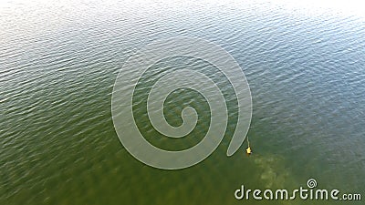 Top view fisherman wade fishing with waterproof jacket wader at Lavon Lake, Texas, USA Stock Photo