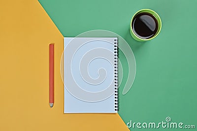 Top view flat lay picture with blank notepad page, coffee cup, pencil and different accessories on colored surface Stock Photo