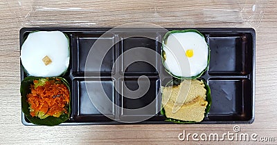 Top view or Flat lay of Thai dessert with pudding with coconut topping, sweet sticky Rice Stock Photo