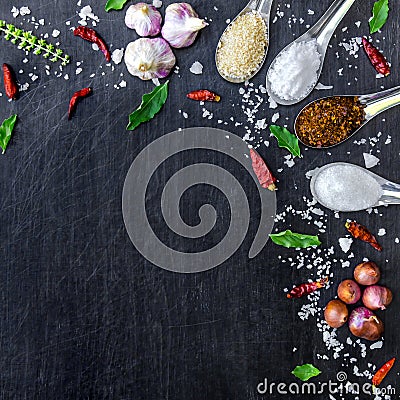 Top view of food ingredients and condiment on the table, Ingredients and seasoning on dark wooden floor Stock Photo