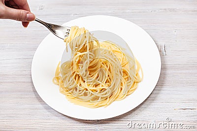 Top view fork wrapped of spaghetti al burro Stock Photo