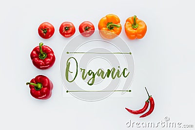 top view of frame of red and orange vegetables with word Organic Stock Photo