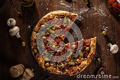 Top view of fresh baked pizza without slice served on wooden tab Stock Photo