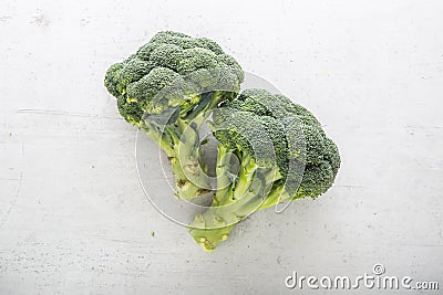 Top of view fresh broccoli on white concrete background Stock Photo