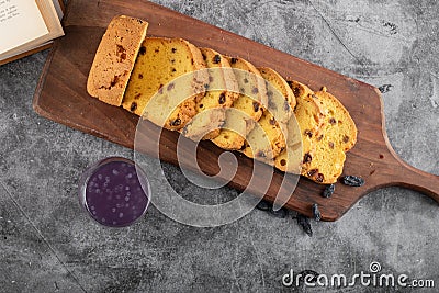 Top view of fresh sliced roulette with grape cocktail on grey background Stock Photo