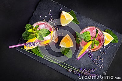 Top view of a fresh summer drink made of lavender, lemon and mint. Stock Photo