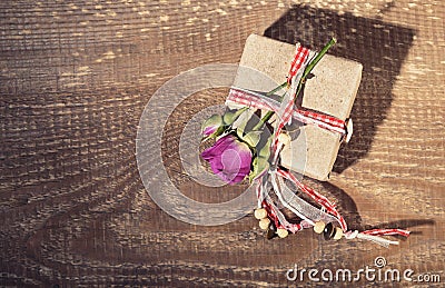 Top view of gift box tied with decorative ribbon and rose flower Stock Photo