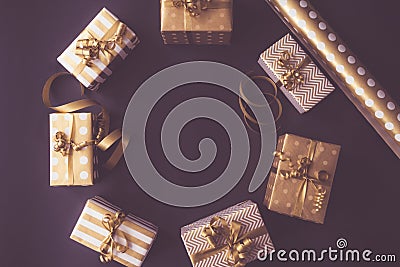 Top view of gift boxes in golden designs. Flat lay, copy space. A concept of Christmas, New Year, birthday celebration Stock Photo