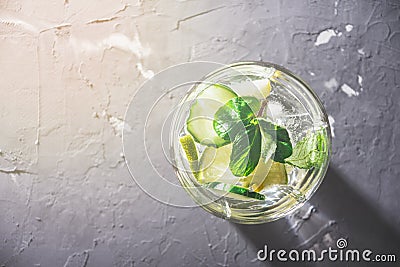 Top view of the glass with non-alcoholic vegetarian cocktail of cucumber, lemon and mint with space for text Stock Photo