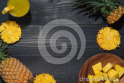 Top view of glasses of pineapple juice and pineapple fruit on a Stock Photo