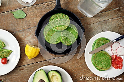 Top view gluten free spinach pancakes vegetables Healthy breakfast Stock Photo