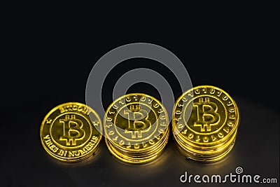 Top view Gold Bitcoin stack on black background. Stock Photo