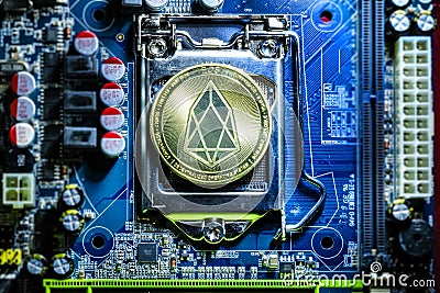 Top view of golden Eos cryptocurrency physical coin Editorial Stock Photo