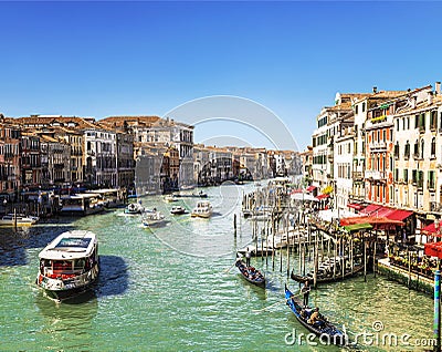 Top view of the Grand Canal, floating gondolas and ships with tourists, Venice Editorial Stock Photo