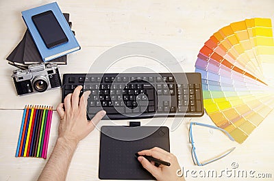 Top view graphic designers hands on table Stock Photo