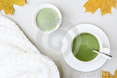 Top view of green tea matcha in a white mug. Matcha ginger latte. Concept - healthy autumn drinks. Stock Photo