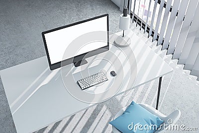 Top view of grey office workplace with blank white computer screen and other items. Mock up Editorial Stock Photo