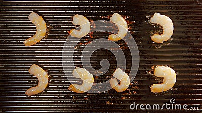 TOP VIEW: Grilled king prawns on a grill Stock Photo