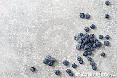 Top view of a group of fresh blueberries on gray background. Stock Photo