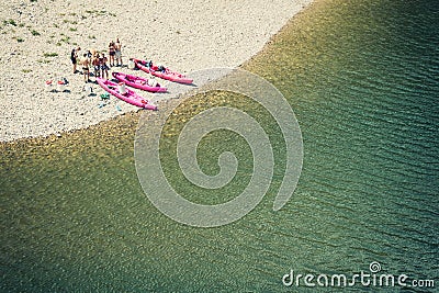 Top view of a group of friends taking a break from canoeing. Stock Photo