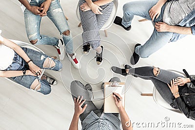 Top view of a group therapy session for teenagers struggling wit Stock Photo