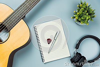 Top view guitar and note book and headphone Stock Photo