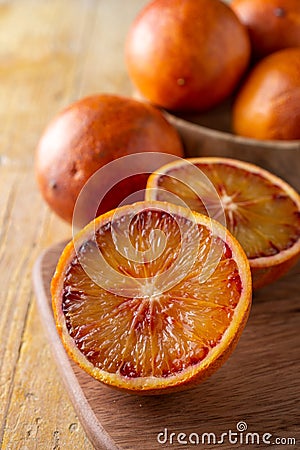 Top view of half blood oranges, with selective focus, on dark table Stock Photo