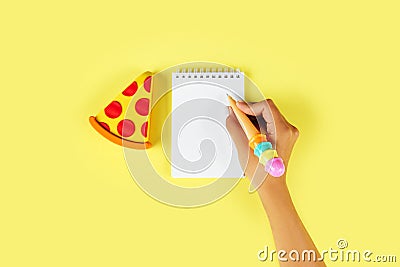 Top view. hand of young woman using pen for writing on blank notebook Stock Photo